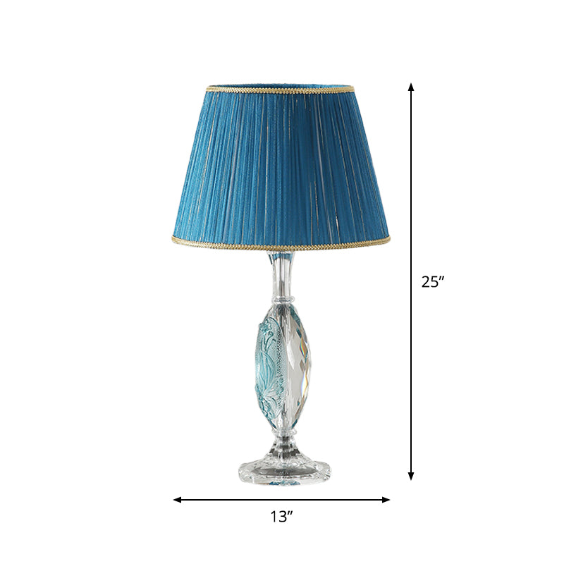 Traditional Clear Crystal Night Light With Blue Fabric Shade And Oblong Base
This Revised Title