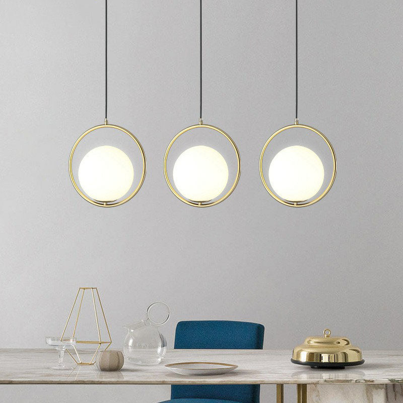 Modern Gold Ring Globe Pendant Ceiling Light With Cream Glass - Bedside Pendulum Design