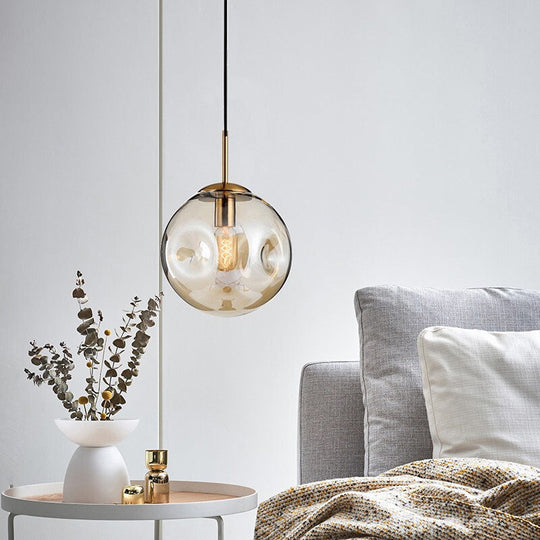 Dimpled Glass Globe Pendant Lamp: Postmodern Brass Hanging Light For Bedroom