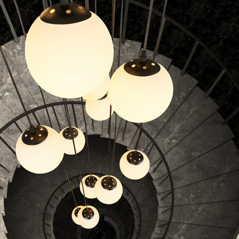 Minimalist Black Globe Pendant Light With Cream Glass - Ideal For Stairways