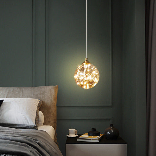Amber Glass Led Pendant Lamp With Brass Finish - Nordic Style Lighting For Bedroom