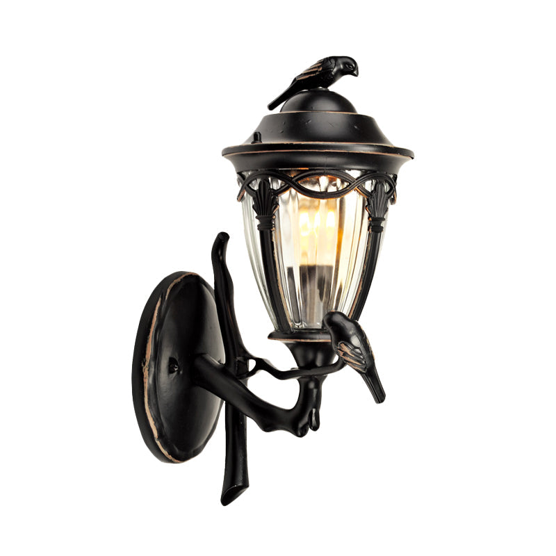 Countryside 1-Light Black Clear Glass Urn Wall Sconce With Bird Decor Perfect For Patio Lighting