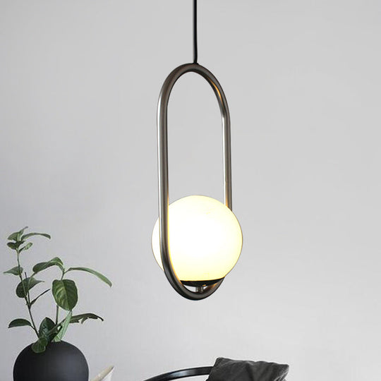 Sleek Chrome Oblong Pendant Light With Minimalist Design And Orb White Glass Shade