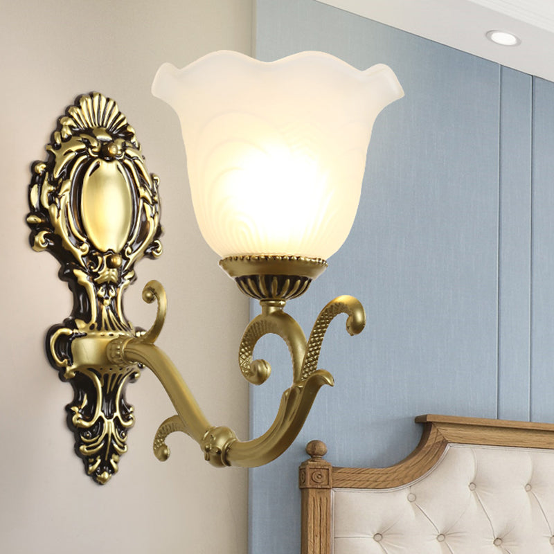 Vintage Brass/Beige Frosted Ribbed Glass Wall Sconce Lamp With Curvy Arm - 1 Light Bloom Brass