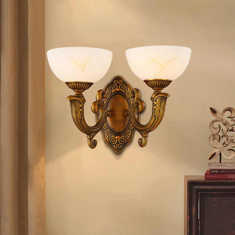 Rustic Brass Wall Sconce With Frosted Glass Shade - Swooping Arm Design For Ambient Lighting
