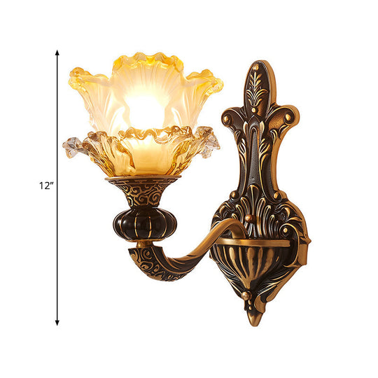 Rustic Half-Head Wall Lamp With Curvy Metallic Design And Flower Amber Glass Shade - Brass Finish