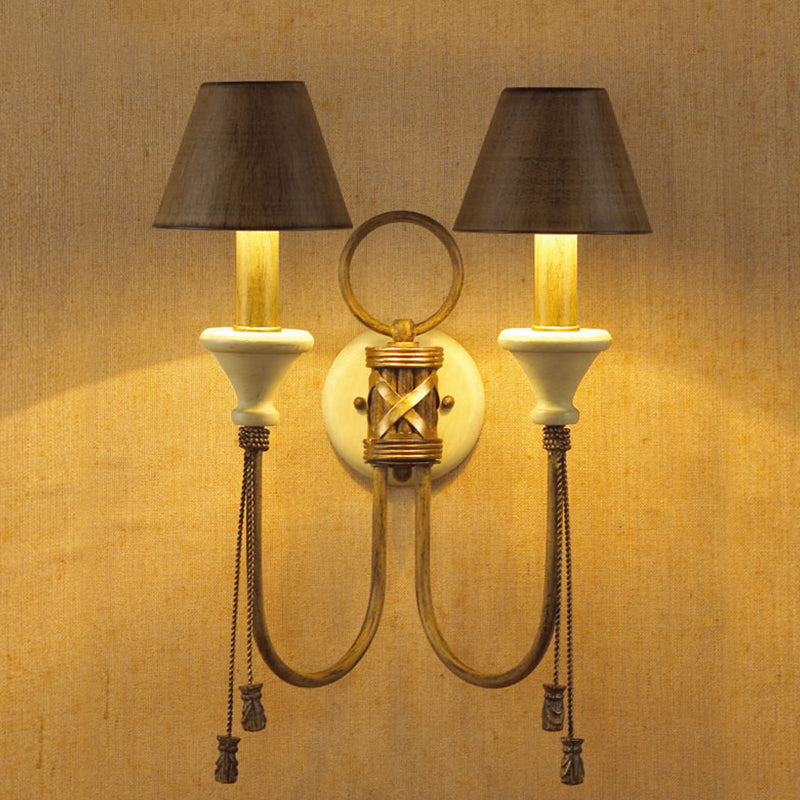 Vintage Iron Swooping Arm Sconce Light - Gold Wall Mount Lamp With Tapered Shade And Carved Spike