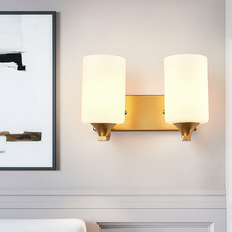 Traditional 2-Bulb Gold Wall Lamp With Milky Glass Cylindrical Fixture