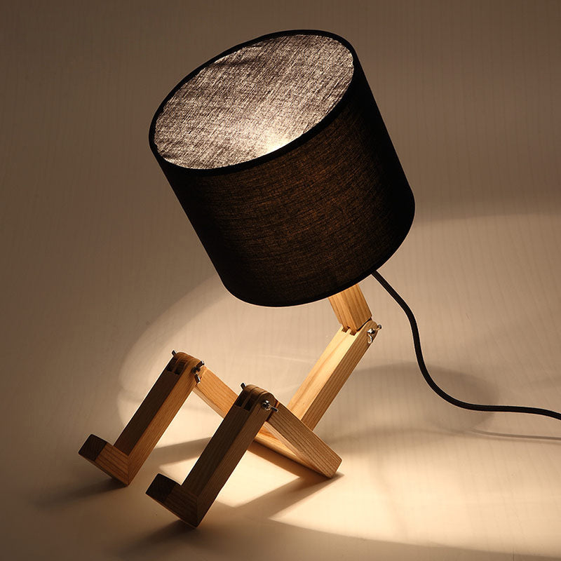 Modern Wood Man-Shaped Table Lamp With Book Rack And Cylinder Fabric Shade - Single