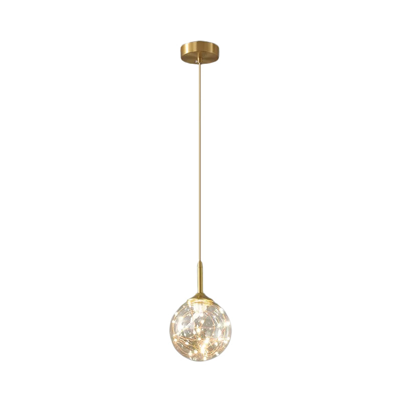 Sleek Brass Sphere Led Pendant Lamp For Modern Dining Rooms