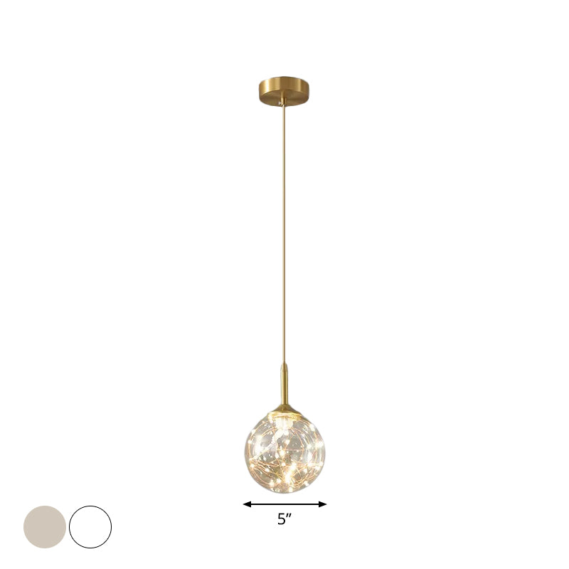 Sleek Brass Sphere Led Pendant Lamp For Modern Dining Rooms