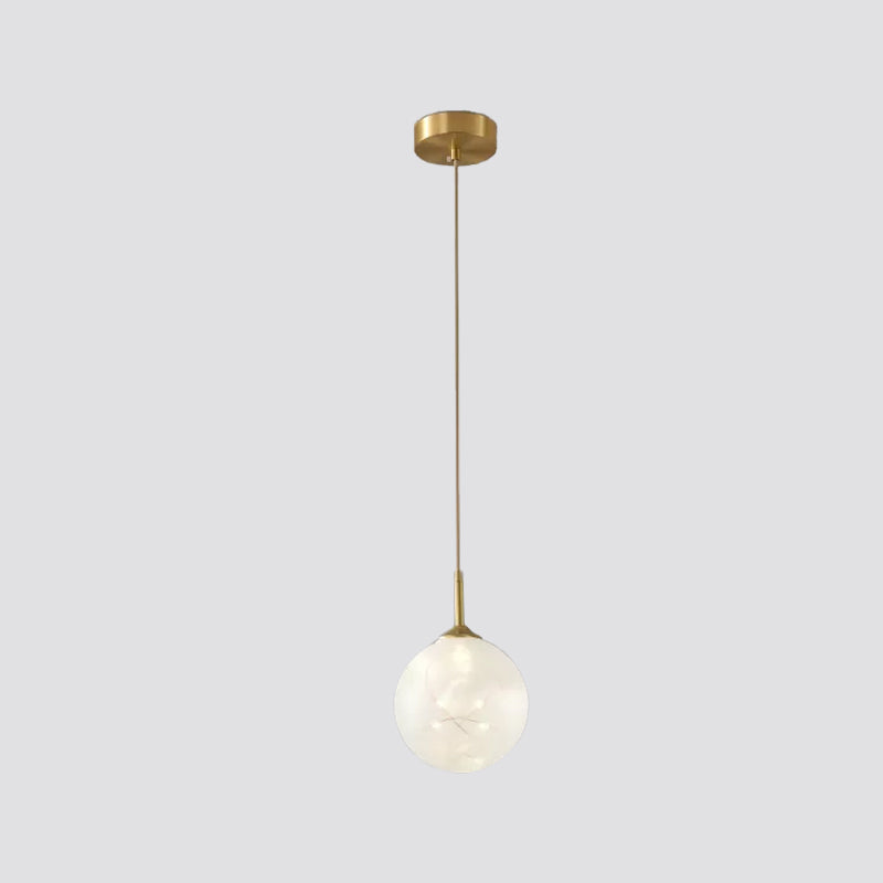 Sleek Brass Sphere Led Pendant Lamp For Modern Dining Rooms