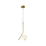 Sleek Brass Sphere Led Pendant Lamp For Modern Dining Rooms