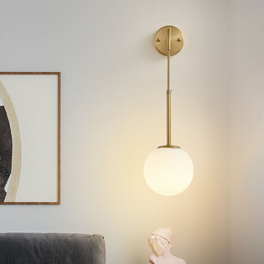 Minimalist Mini Globe Wall Sconce With Cream Glass And Gold Finish For 1-Bulb Lighting