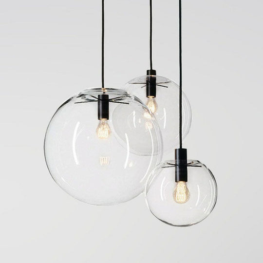 Minimalistic 1-Light Black Pendant Light Fixture - Clear Glass Globe Design For Restaurants