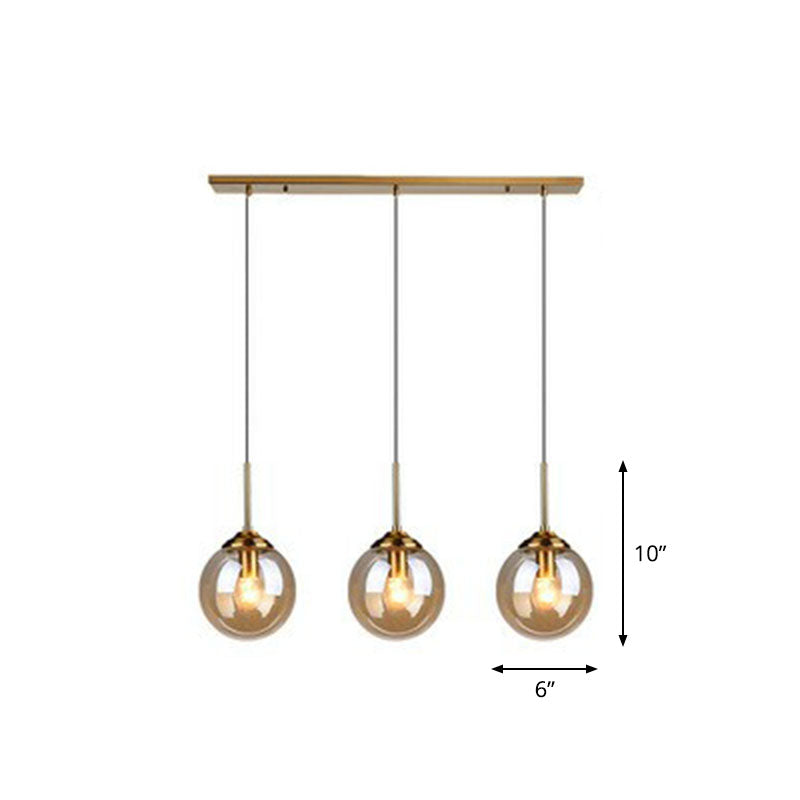 Sleek Glass 3-Bulb Brass Suspension Pendant Light For Minimalistic Dining Room Decor