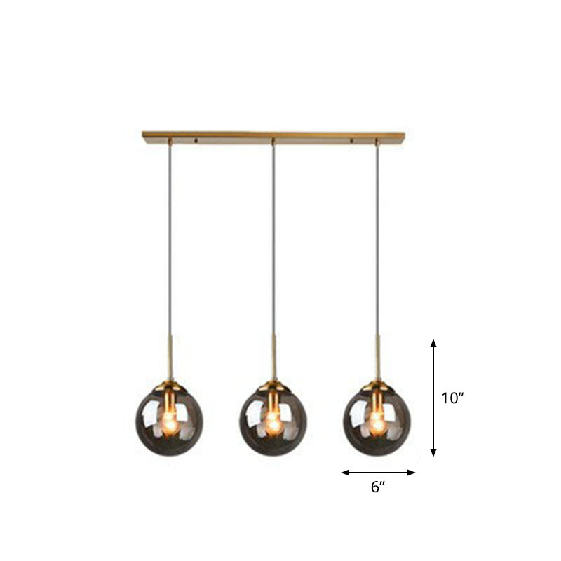 Sleek Glass 3-Bulb Brass Suspension Pendant Light For Minimalistic Dining Room Decor