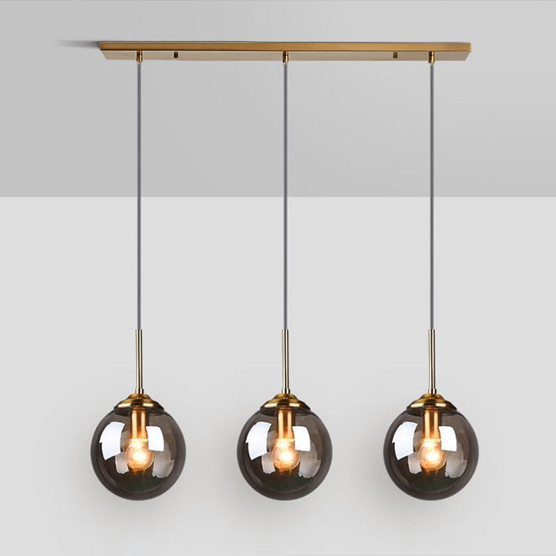 Sleek Glass 3-Bulb Brass Suspension Pendant Light For Minimalistic Dining Room Decor