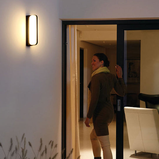 Minimalist Black Acrylic Led Wall Sconce For Yard - Capsule Shape
