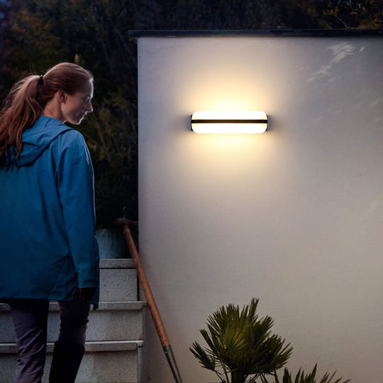 Minimalist Black Acrylic Led Wall Sconce For Yard - Capsule Shape