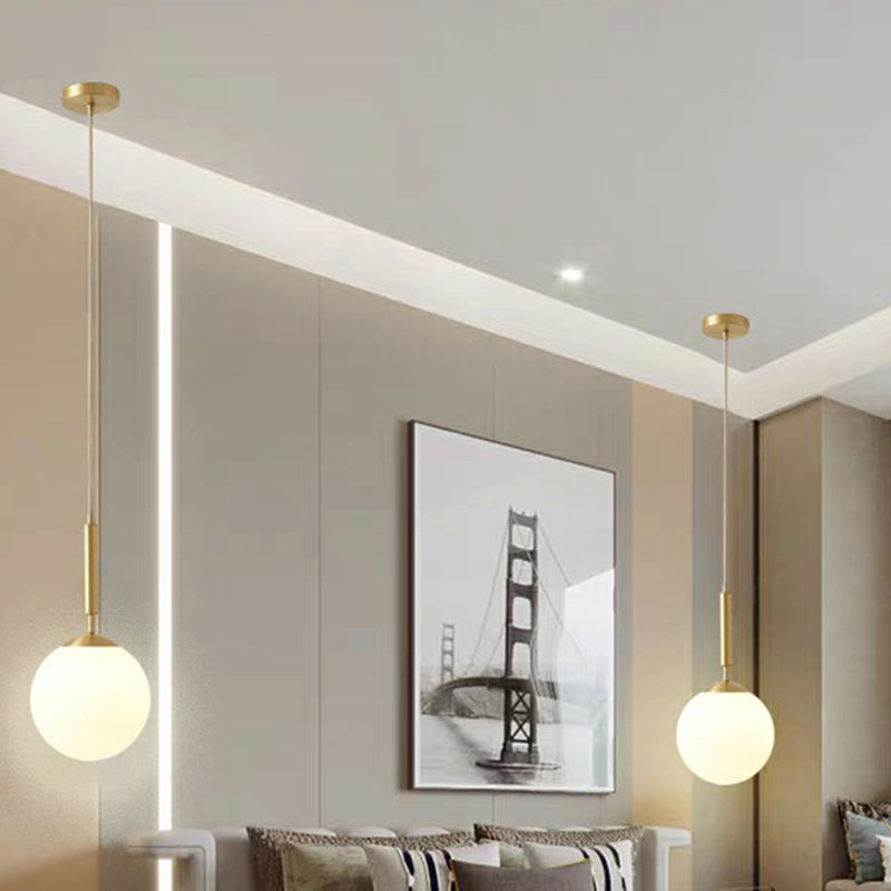 Minimalist Milk Glass Ball Pendant Light In Brass - 1-Light Hanging Lamp For Dining Room