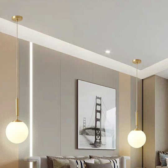 Minimalist Milk Glass Ball Pendant Light In Brass - 1-Light Hanging Lamp For Dining Room