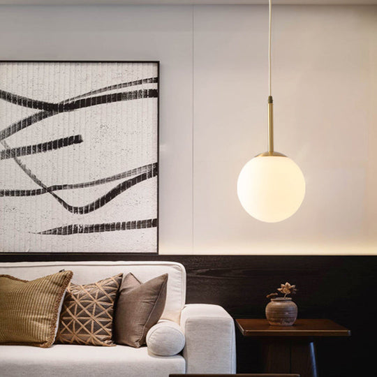 Mid-Century Modern Brass Pendant Light With Spherical White Glass Shade