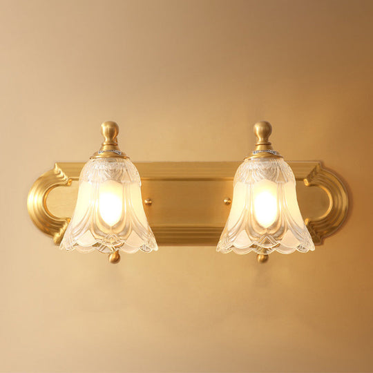 Brass Armed Wall Sconce With Ribbed Glass Shade For Bathroom Decoration