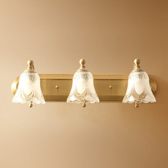 Brass Armed Wall Sconce With Ribbed Glass Shade For Bathroom Decoration