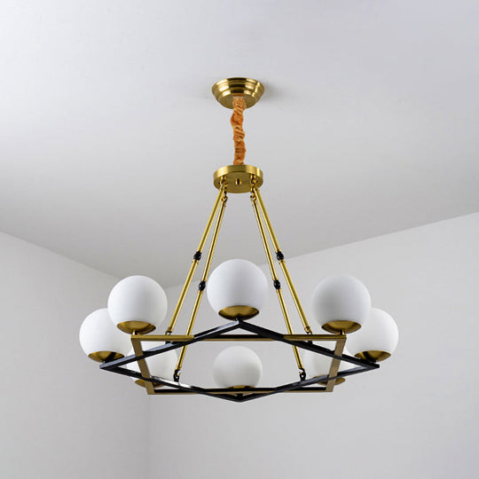 Postmodern Polygon Metal Chandelier With Brass Finish And Globe White Glass Shades