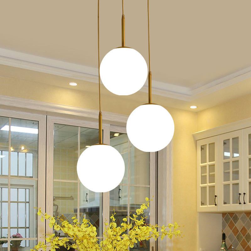 Modern White Glass Orb Hanging Ceiling Light With 3 Lights And Brass Finish