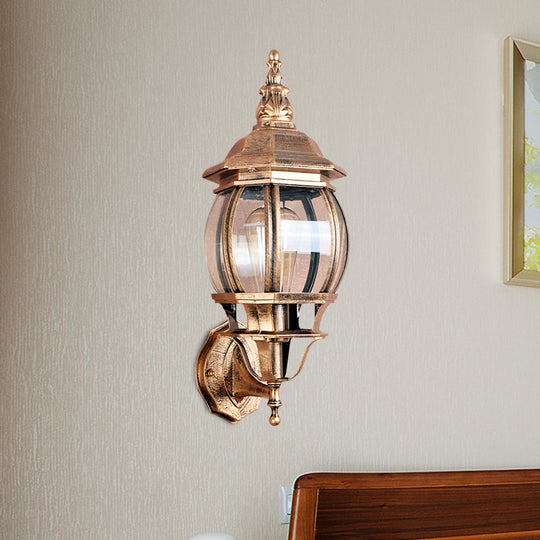 Country Outdoor Wall Light With Clear Glass Shade In Brass - 1 Bulb Fixture