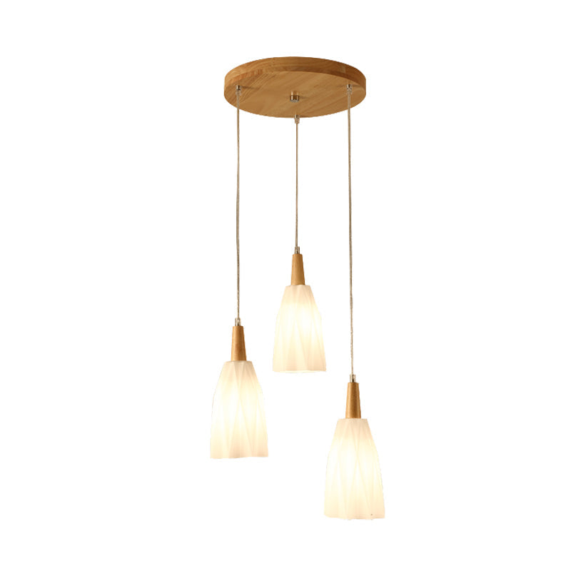 Japanese 3-Light Glass Pendant With Prismatic Cluster In White Hangs From Wood Canopy