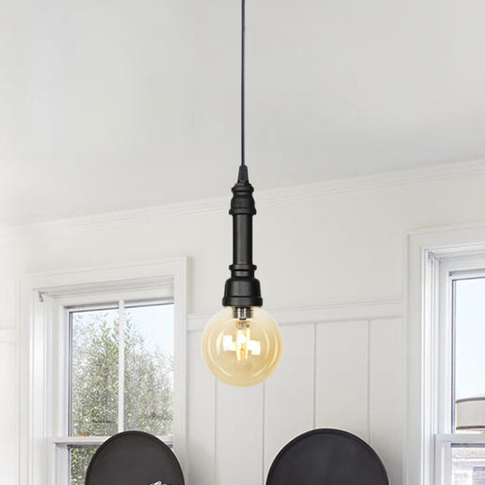 Industrial Black Finish Amber Glass Pendant Lamp With Pipe Suspension - 1-Light Ball/Capsule