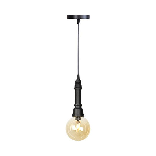 Industrial Black Finish Amber Glass Pendant Lamp With Pipe Suspension - 1-Light Ball/Capsule