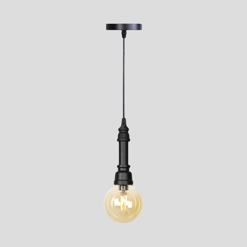 Industrial Black Finish Amber Glass Pendant Lamp With Pipe Suspension - 1-Light Ball/Capsule