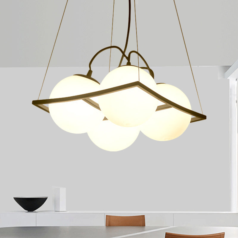 Modernist Frosted Glass Pendant Light With Globe Design - 3/4 Lights Black Frame For Ceiling Hang