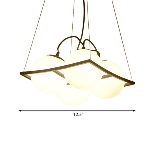 Modernist Frosted Glass Pendant Light With Globe Design - 3/4 Lights Black Frame For Ceiling Hang