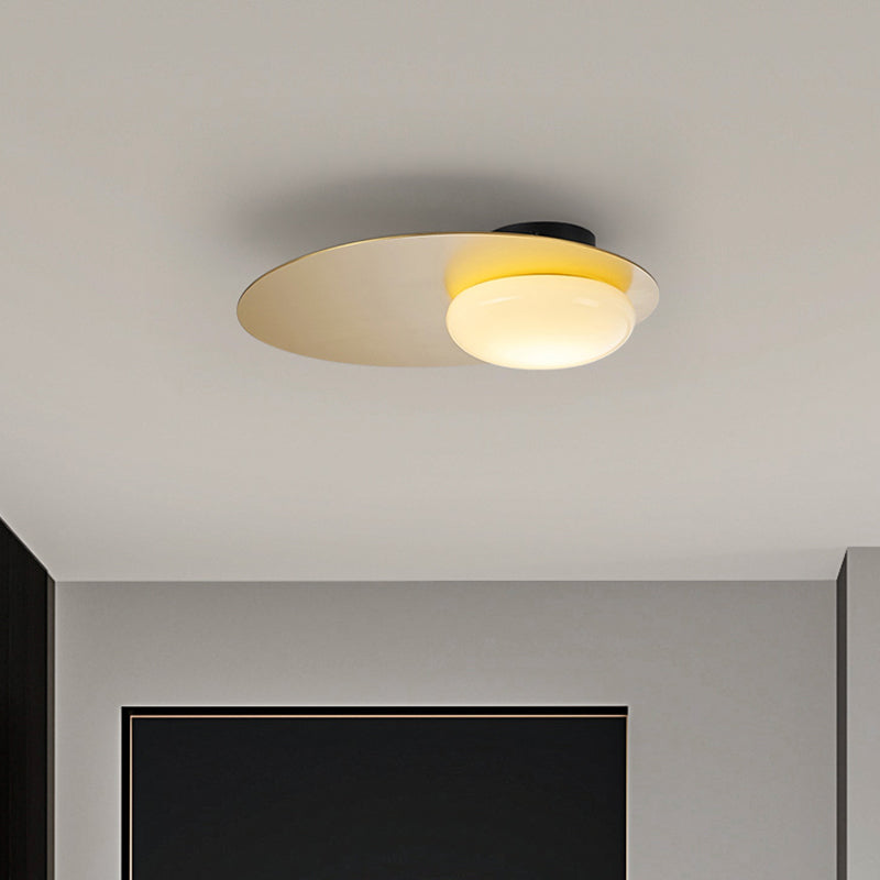 Modern Cream Glass Flush Mount Lamp: Designer 1-Light Ceiling Fixture With Black/Brass Disk Top
