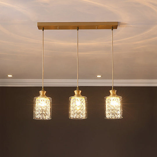 Modernist Gold Pendant Lamp With Faceted Crystal And Clear Glass Shade - 3 Heads