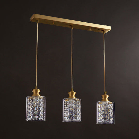 Modernist Gold Pendant Lamp With Faceted Crystal And Clear Glass Shade - 3 Heads