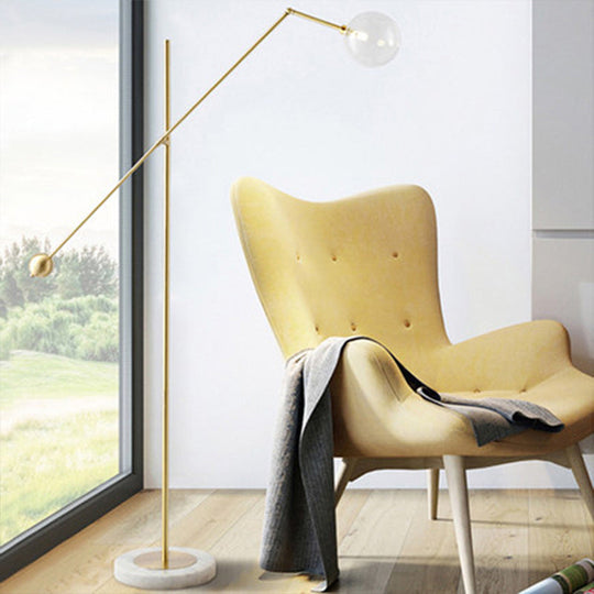 Modernist Gold Metal Balance Arm Task Floor Lamp With Orb Design Single Bulb Standing Light For