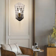 Black Modernist Wall Sconce With Curved Metal Arm And Clear Crystal Panel