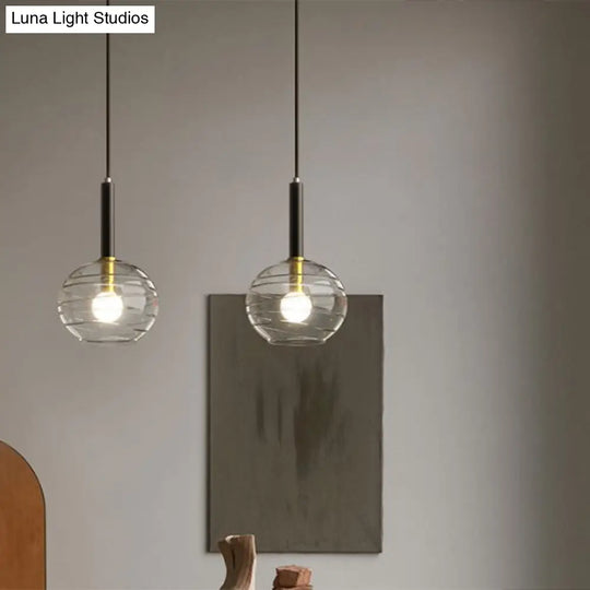 Black Textured Glass Dining Room Pendant With Modern Spherical Hanging Design