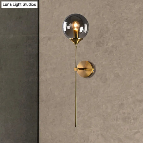 Brass Globe Shade Wall Sconce - Modern Single Bulb Clear/Grey/Amber Glass Light For Bedroom