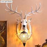 Clear Beveled Crystal Sconce With Rural White/Brown/Black Finish And Faux Elk Backplate - Bedroom