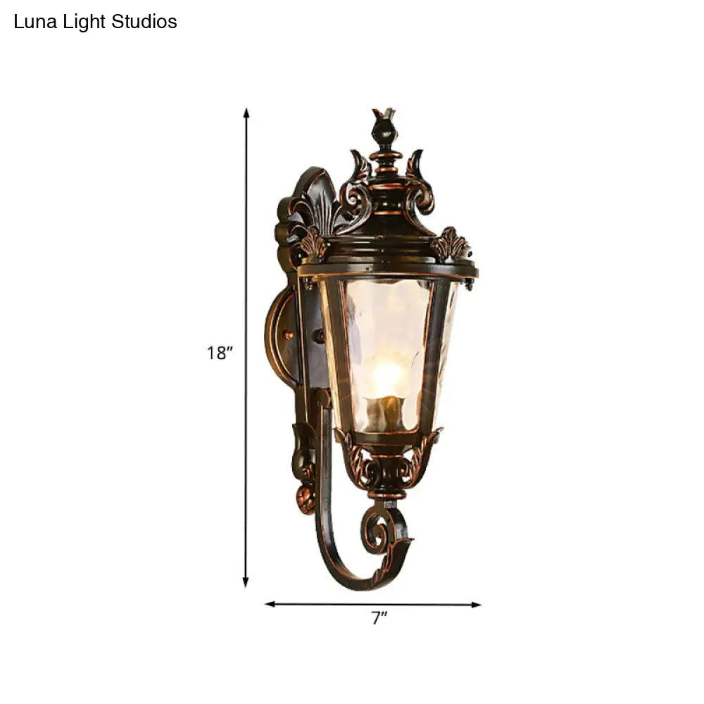 Clear Water Glass Outdoor Wall Sconce: Scrolled Arm 1-Light Black & Gold Lodge Lighting