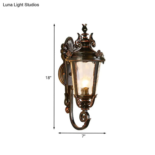 Clear Water Glass Outdoor Wall Sconce: Scrolled Arm 1-Light Black & Gold Lodge Lighting