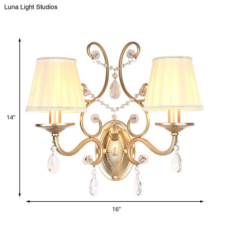 Contemporary Crystal Wall Sconce With Curved Arm And Brass Finish