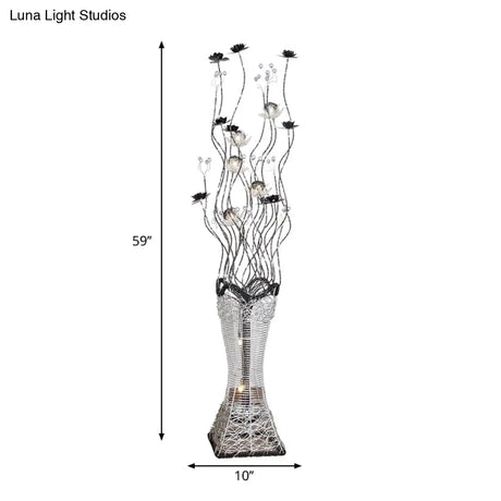 Contemporary Torch-Like Led Floor Light With Curvy Arm And Floret Decor In Black/Silver